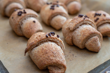 baking home made chocolate croissants with chocolate nibs