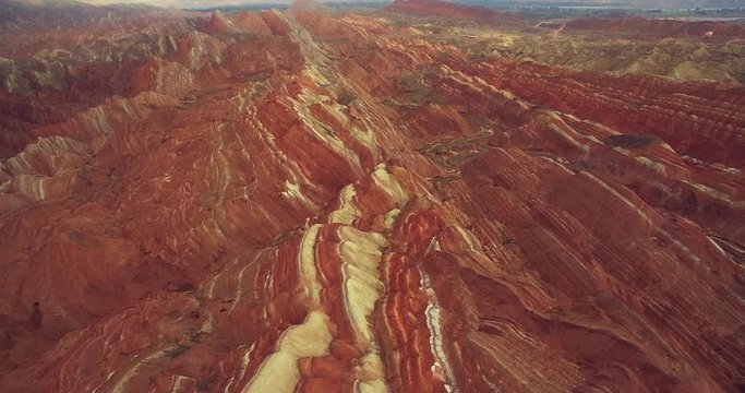 Aerial above view of colorful Danxia rock formations of The Zhangye National Geopark in Gansu province of China, 4k drone nature landscape footage