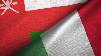 Fototapeta na wymiar Oman and Italy two flags textile cloth, fabric texture