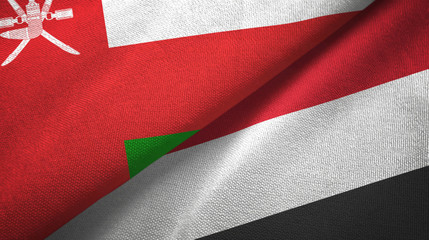 Fototapeta na wymiar Oman and Yemen two flags textile cloth, fabric texture