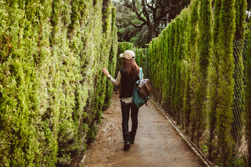 Young woman walking in the park labyrinth