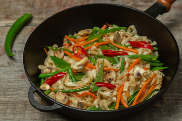 Chow Mein egg noodles with vegetables and mushrooms