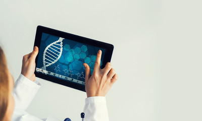 Close of female doctor hands working with tablet pc computer