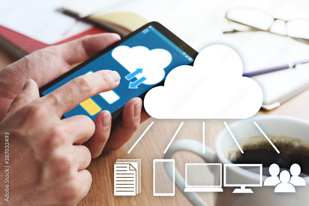 Poster Closeup of male hands touching smartphone screen for using cloud app at table. Cloud app and devices icons.