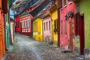 Fototapeta na wymiar Cityscape of colorful street in old town Sighisoara, Romania