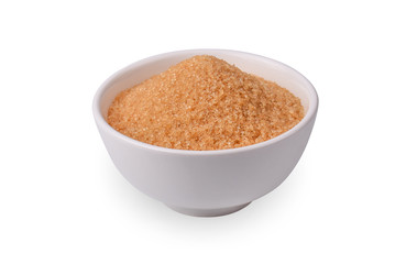 Brown refined sugar in bowl on white background.