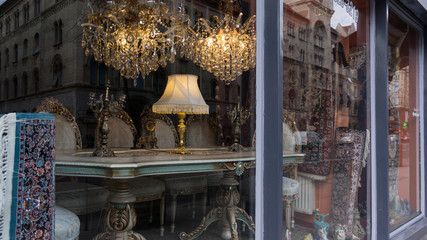 Chair and table in the Baroque style in a shop window