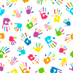 Fototapeta premium Seamless background made from colorful handprints. Palms and fingers colored in rainbow colors. Multicolor pattern for your design.