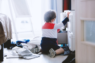child makes a mess in the closet