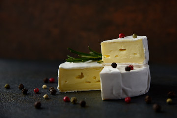 Cheese camembert or brie with fresh rosemary