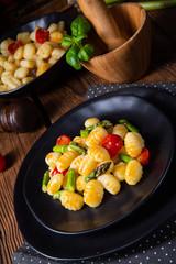 crispy gnocchi with roasted asparagus and tomatoes