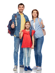 Obraz premium family, tourism and travel concept - happy smiling mother, father and little daughter with backpacks showing thumbs up over white background