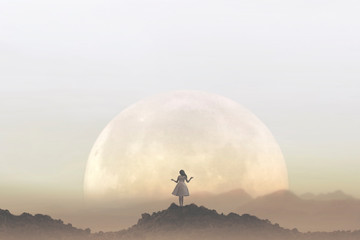 Naklejka na ściany i meble woman meditates in front of a giant moon