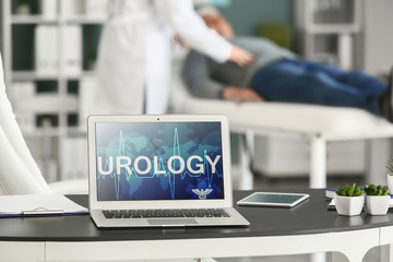 Laptop with word UROLOGY on screen in doctor's office
