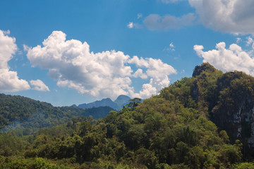 View of the green mountains and blue sky with white clouds