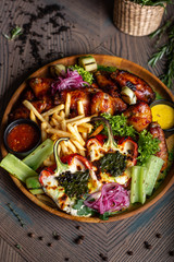 Fried chicken wings and French fries. Menu