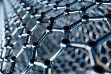 Graphene molecular nano technology structure on a blue background - 3d rendering