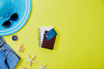 Flat lay yellow summer travel concept background