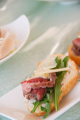 fresh salad with ham and goat cheese