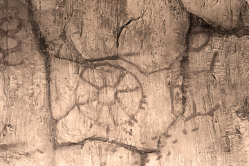 The image of an ancient man on the wall of the cave. history of antiquities, archaeology.
