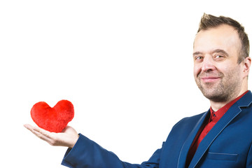 Man in suit holding heart