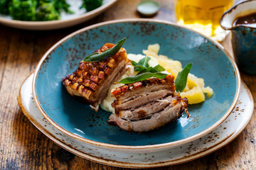 Pork belly with crispy crackling, mash potatoes and apple sauce