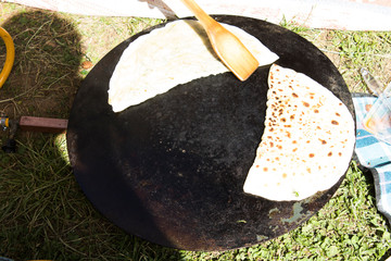 Cheese and spinach gozleme baked on sheet iron