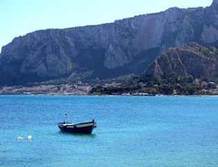Fototapeta na wymiar cute fishing boats in Sicily, Italy with blue sky and sea
