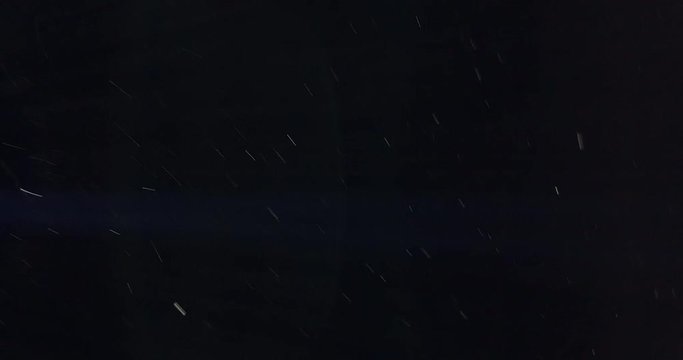 Fast Moving Dust Particles On Black Backlit