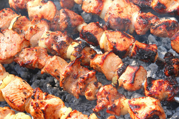Barbecue skewers with juicy appetizing delicious meat closeup