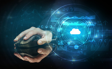 Hand using wireless mouse with cloud technology concept and dark background
