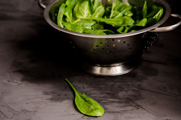 strainer on a black rustic background