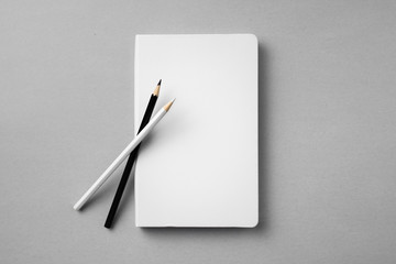 white notebook isolated on grey background