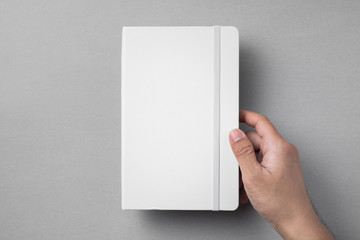 white notebook isolated on grey background