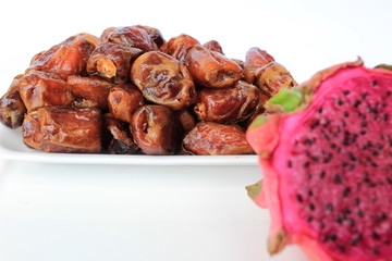 dragon fruit and date or kurma, two fruits that are suitable for health, the concept of food in the month of Islamic Ramadan