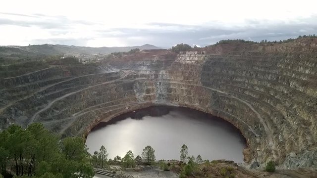 Located in a region that legend claims was part of King Solomon's mines, the Rio Tinto (Huelva, Spain) looks like deep, red wine, because iron is dissolved in the highly acidic river water. Mining act