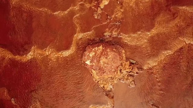 Located in a region that legend claims was part of King Solomon's mines, the Rio Tinto (Huelva, Spain) looks like deep, red wine, because iron is dissolved in the highly acidic river water. Mining act