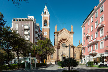 Old church between new buildings