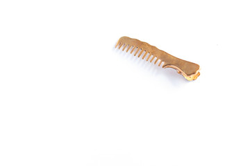Modern metal barrette hair clip on a white background isolated, hairbrush.