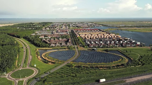 Aerial View on Solar panels island in the new residential district in Almere, The Netherlands, providing city heating