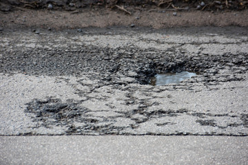 Water pit in rough asphalt canvas