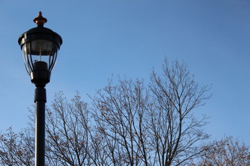 old street lamp on blue sky