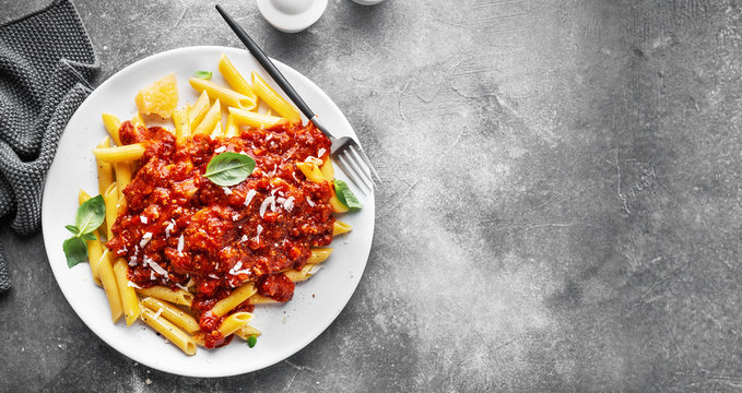 Bolognese penne pasta served on plate