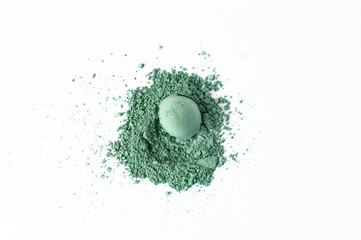 Natural green colored pigment. Loose cosmetic powder. Matt eyeshadow pigment isolated on a white...