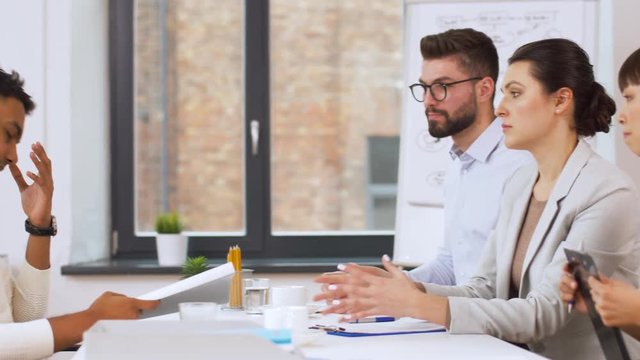 fail, hiring and employment concept - international team of recruiters having interview with indian male employee at office