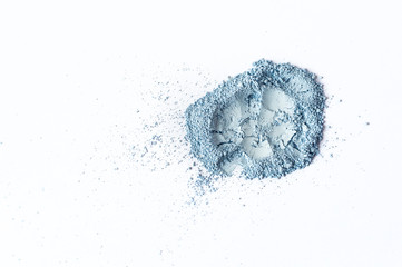 Natural pastel blue colored matt pigment. Loose cosmetic powder. Eyeshadow pigment isolated on a white background, close-up