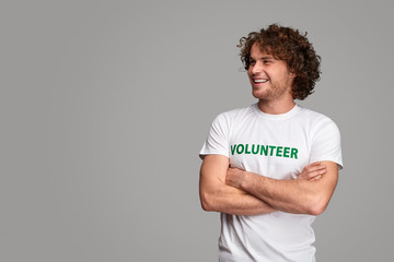 Confident volunteer looking away