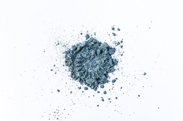 Fototapeta na wymiar Natural blue colored satin pigment. Loose cosmetic powder. Eyeshadow pigment isolated on a white background, close-up