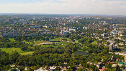 Fototapeta na wymiar Aerial shot of a park in Chisinau City. Blue sky with clouds. Botanica, Chisinau, Moldova