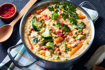 broccoli cheddar cheese soup in a metal pot